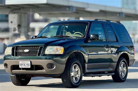 A front-side view of a silver 2003 Ford Explorer XLT