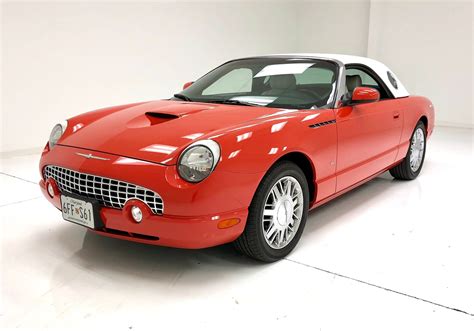 A sleek 2003 Ford Thunderbird parked outdoors, showcasing its retro-inspired design.