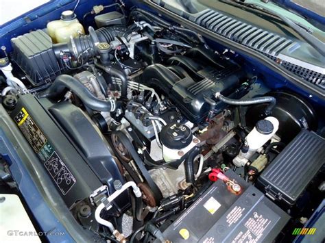 Mechanic performing an oil change on a 2004 Ford Explorer XLT