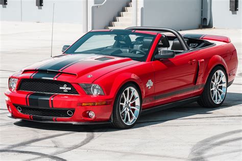 A striking front-angle view of a 2008 Ford Mustang Convertible, highlighting its iconic grille and headlights.