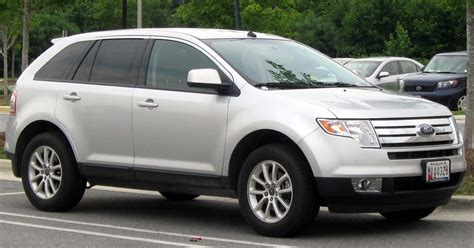 A sleek silver 2010 Ford Edge parked outdoors