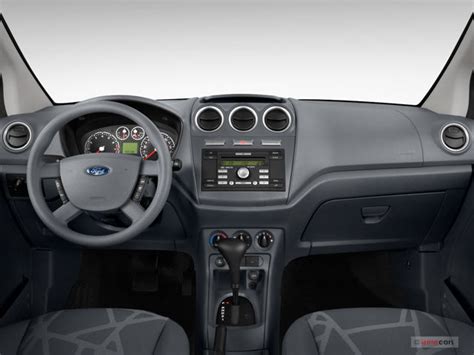 Organized interior of a 2011 Ford Transit Connect with shelving