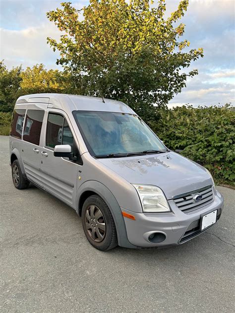 A customized 2012 Ford Transit Connect showcasing a creative interior build for a specific purpose