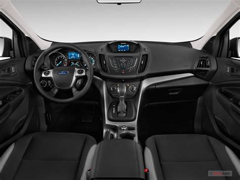 Interior view of a 2014 Ford Escape, highlighting its comfortable seating and dashboard