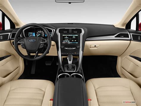 Interior view of a 2014 Ford Fusion showcasing its modern dashboard and comfortable seating
