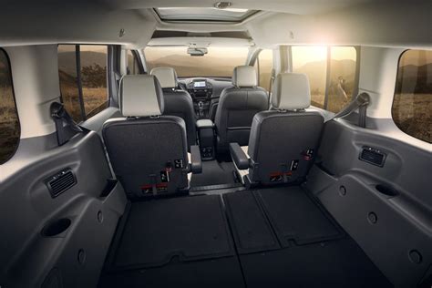 Interior view of the 2014 Ford Transit Connect XLT showing its spacious cabin and features