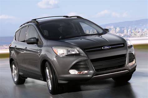 2015 Ford Escape parked in a suburban driveway, showcasing its compact SUV design