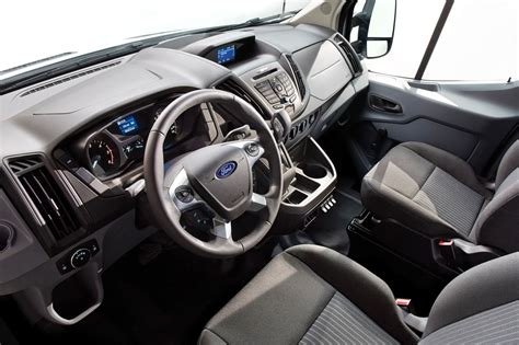 Spacious interior of a 2016 Ford Transit van, showcasing its cargo potential