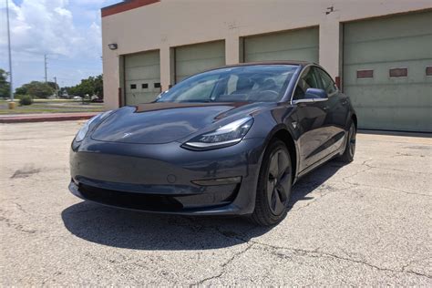 2021 tesla model 3 curb weight