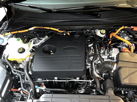 Close-up of the 2022 Ford Escape Hybrid powertrain components, illustrating its advanced hybrid technology