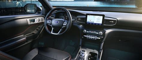 Interior view of the 2024 Ford Explorer ST, showcasing its sporty seats and modern dashboard, hinting at the driver-focused experience