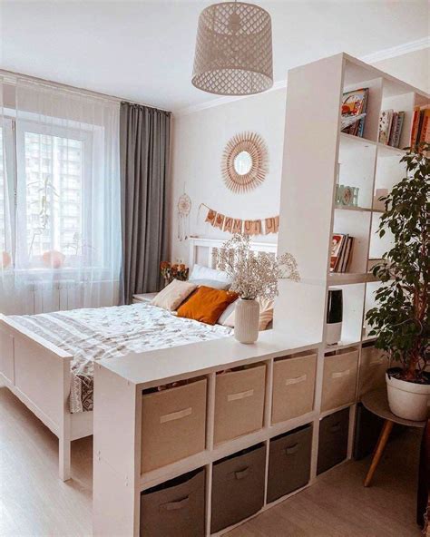 3. Zone a small modern bedroom with a room divider