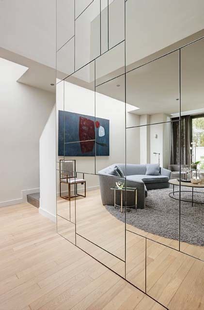 4. Use a mirrored wall to double your space visually