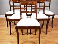 6 Wooden dining chairs available second hand in Wood Green, London