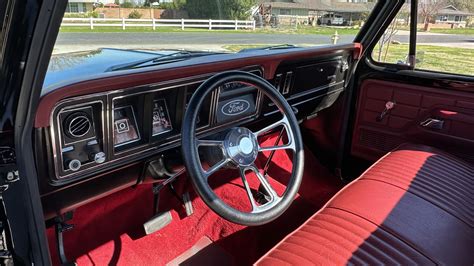 Classic 73 Ford F100 interior showcasing its vintage dashboard and seating