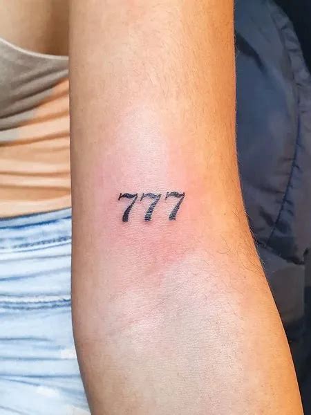 777 Neck Tattoo