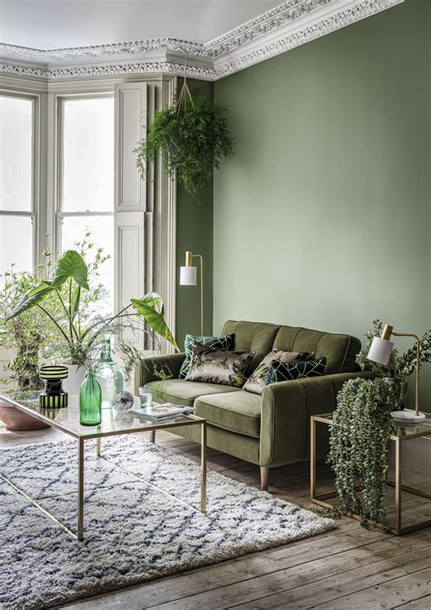 9. Go for pattern-on-pattern in a green living room scheme