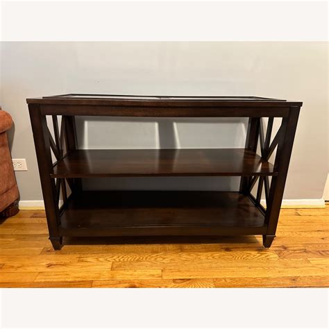 9. Use a tiered console table design