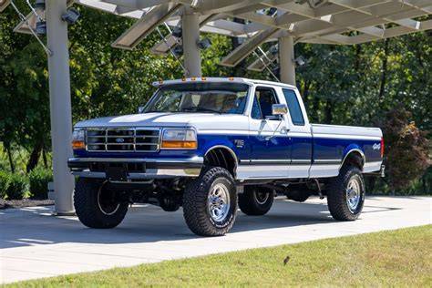 A classic 96 Ford F-250 parked outdoors, showcasing its robust design and iconic silhouette.