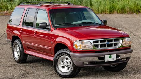 1997 Ford Explorer parked on a scenic overlook