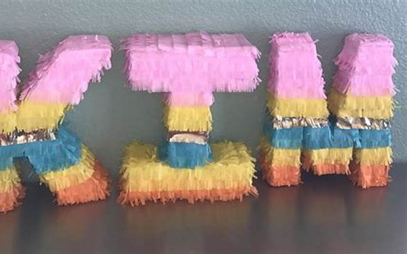 A Piñata With Letter Accents Spelling Out A Name