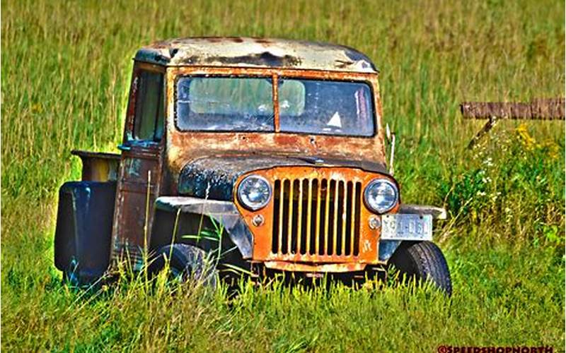 A Vintage Jeep Parked On A Dirt Road