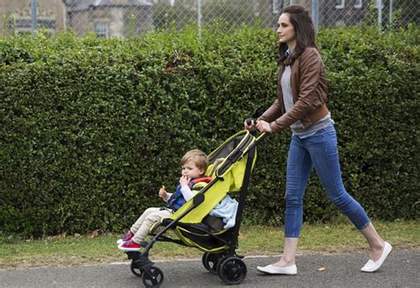 A Person Pushing A Stroller
