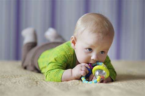 A baby playing with a toy