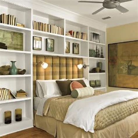 A bedroom with built-in storage and shelves