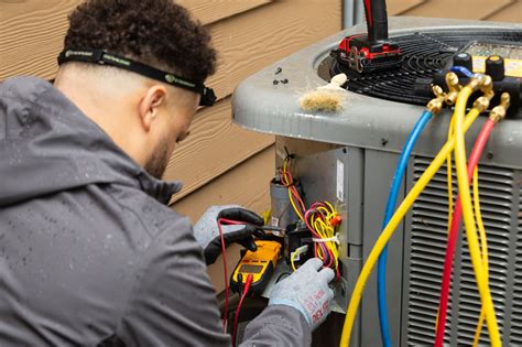 AC Repair Technician Checking AC Unit