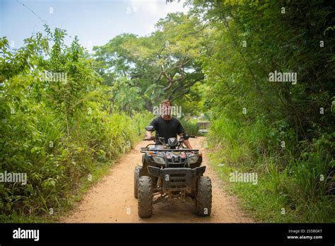 ATV driving through jungle