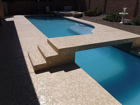 Acrylic lace pool deck with intricate patterns and swirls