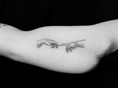 Adam Hands Tattoo