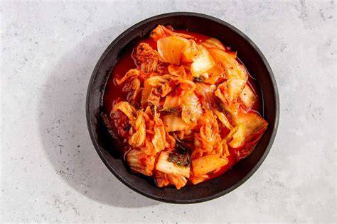 Add the chopped kimchi to the skillet and cook for a few minutes, stirring constantly.
