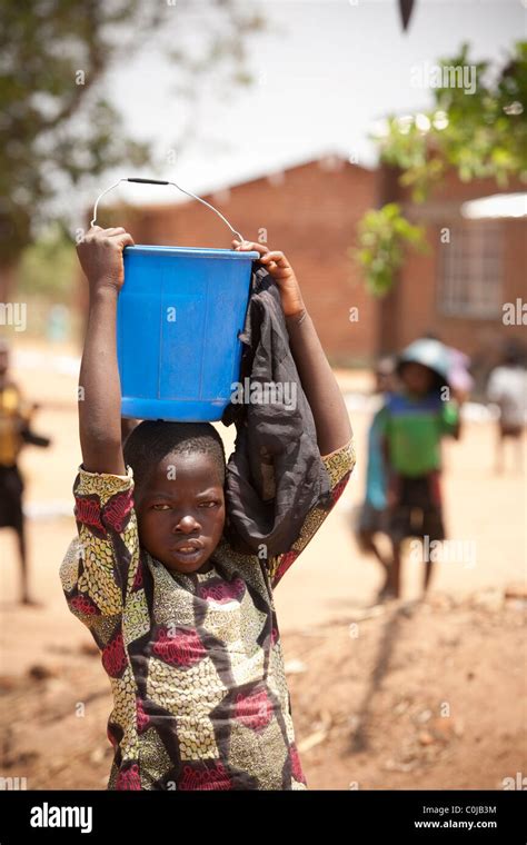 African Kid In A Bucket