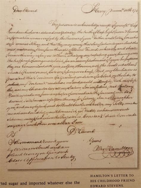 Image of Alexander Hamilton writing at his desk