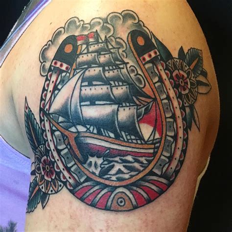 Ship sailboat travel American style forearm tattoo