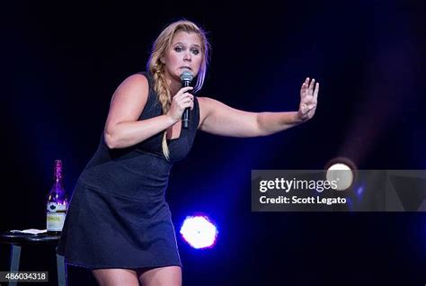 Amy Schumer performing stand-up comedy.