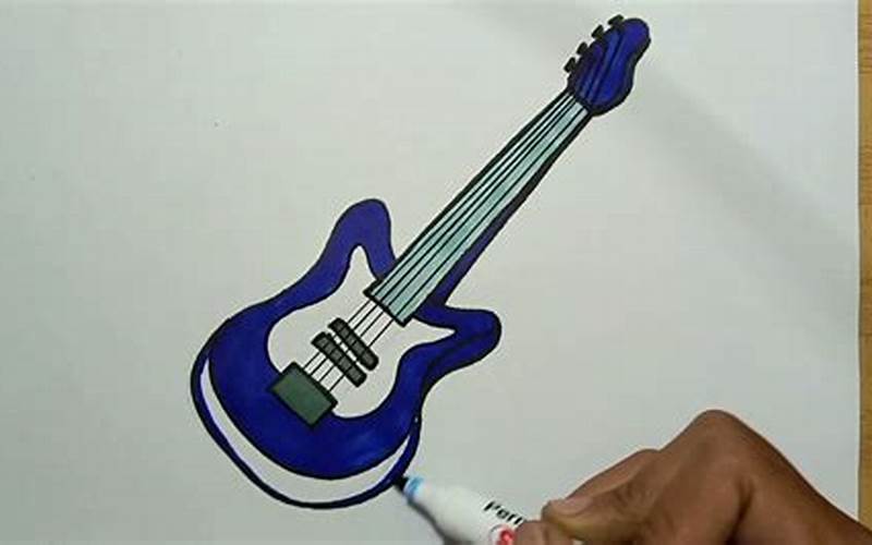 An Artist Practicing Drawing A Bass Guitar