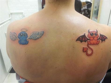 Angel And Devil Tattoos On Shoulders