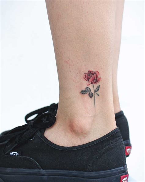 Little rose single needle tattoo on the back of the ankle