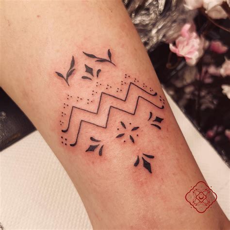 Aquarius Tattoo For Ladies