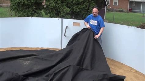 Armour Shield Pool Pad being installed on pool floor