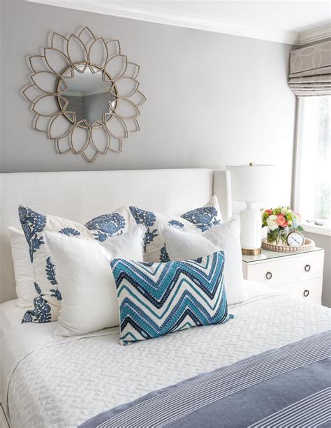 Arranging Decorative Pillows on a Bed