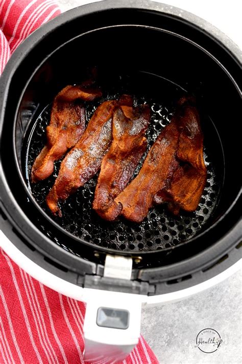 Arranging bacon in the air fryer basket