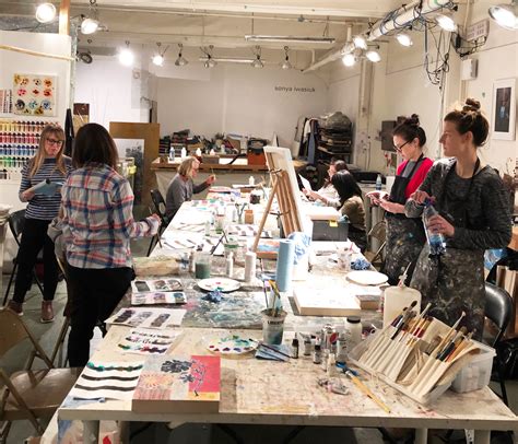 A group of people taking an art class in a studio