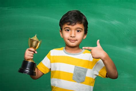 Asian Kid With Trophy