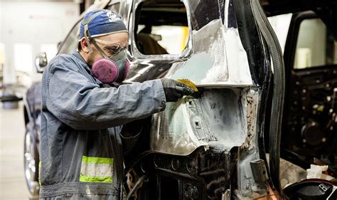 Auto Body Repair Technician Using a Computer