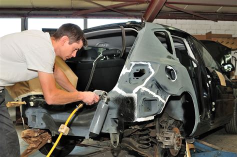 Auto body repair technician working