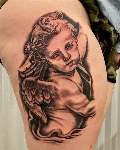 Grey Ink Sleeping Baby Angel Tattoo Design On Lowerback